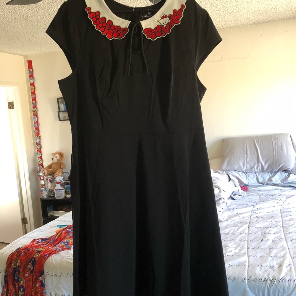 Classic looking black dress with Hello Kitty Adds